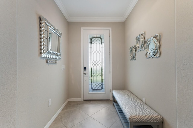 tiled foyer entrance featuring crown molding