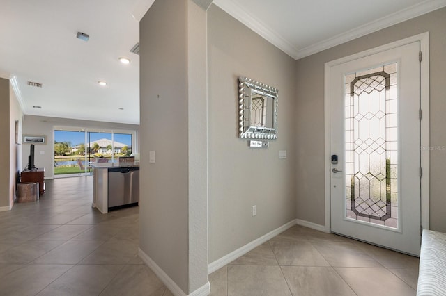 tiled entrance foyer with crown molding