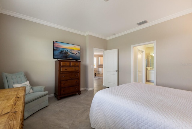 bedroom with crown molding, light carpet, and ensuite bathroom