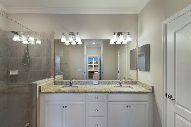 bathroom with crown molding, an enclosed shower, and vanity