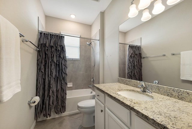 full bathroom featuring vanity, tile patterned floors, toilet, and shower / bath combo with shower curtain