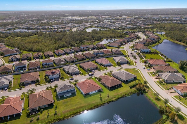 drone / aerial view with a water view