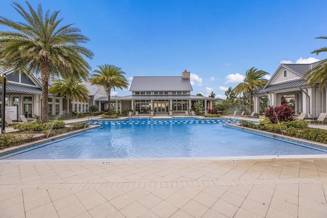 view of pool featuring a patio