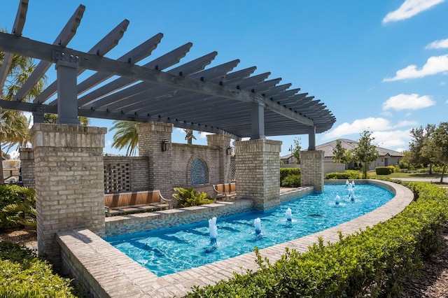 view of swimming pool featuring pool water feature and a pergola