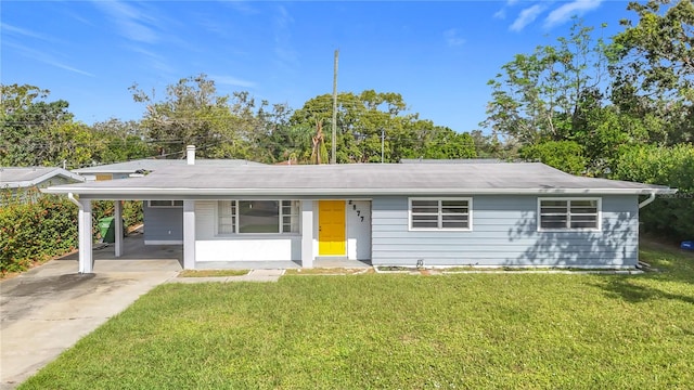 ranch-style home featuring a front yard and a carport