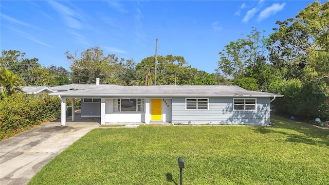 ranch-style home with a front yard and a carport