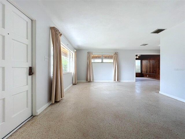 2877 Michigan St, Sarasota, FL 34237 - spare room featuring baseboards and speckled floor