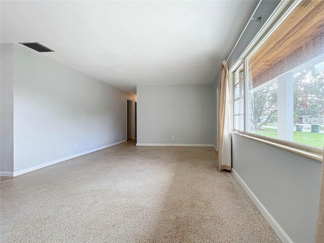 2877 Michigan St, Sarasota, FL 34237 - unfurnished room with speckled floor and baseboards