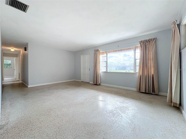 2877 Michigan St, Sarasota, FL 34237 - spare room featuring healthy amount of natural light and baseboards