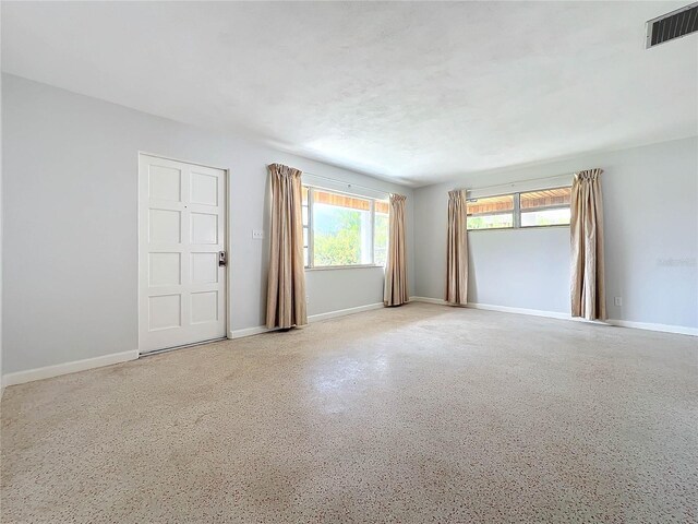 2877 Michigan St, Sarasota, FL 34237 - spare room with baseboards and speckle patterned floor