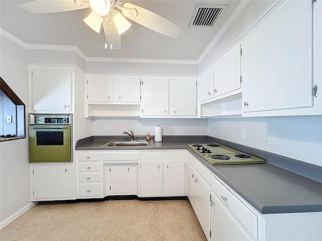 kitchen with sink, white gas stovetop, crown molding, oven, and white cabinets