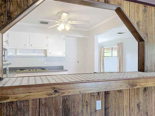 2877 Michigan St, Sarasota, FL 34237 - kitchen featuring ceiling fan, white cabinetry, tile counters, ornamental molding, and open shelves