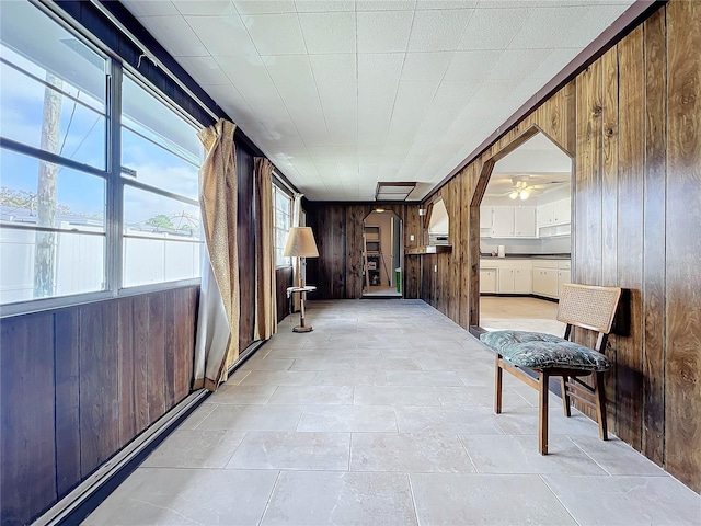 2877 Michigan St, Sarasota, FL 34237 - hallway featuring wooden walls and arched walkways