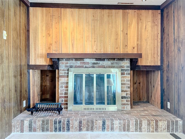 details with wood walls and a fireplace