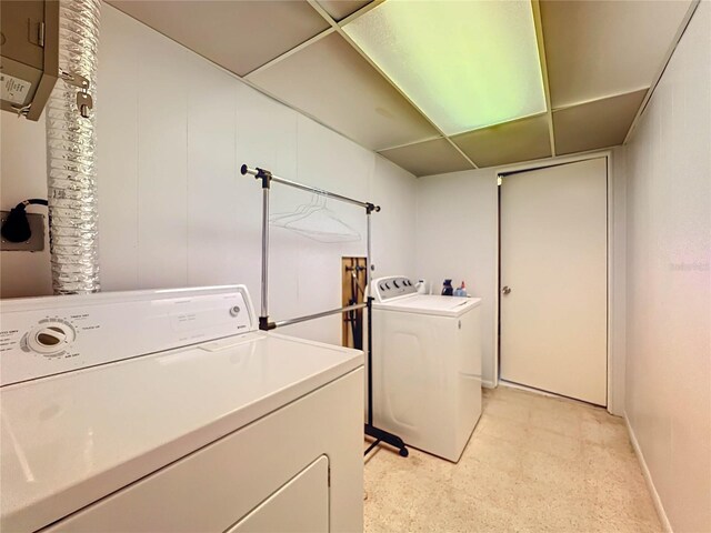 2877 Michigan St, Sarasota, FL 34237 - laundry area with washing machine and clothes dryer and baseboards