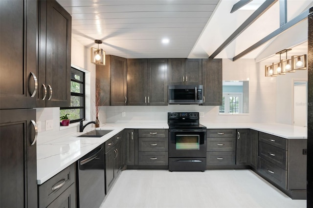 kitchen featuring decorative light fixtures, sink, backsplash, black appliances, and dark brown cabinets