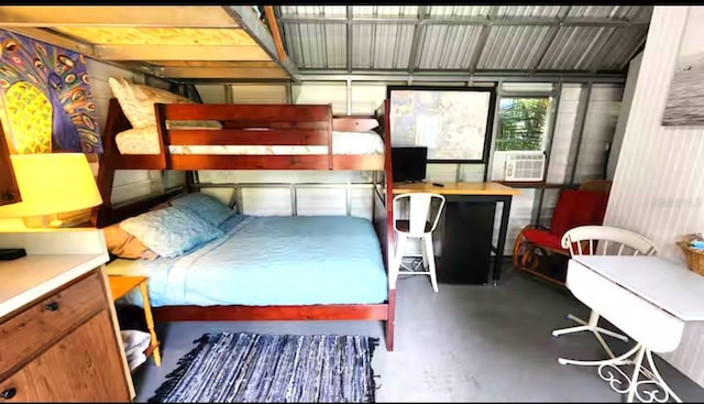 bedroom featuring concrete floors and cooling unit