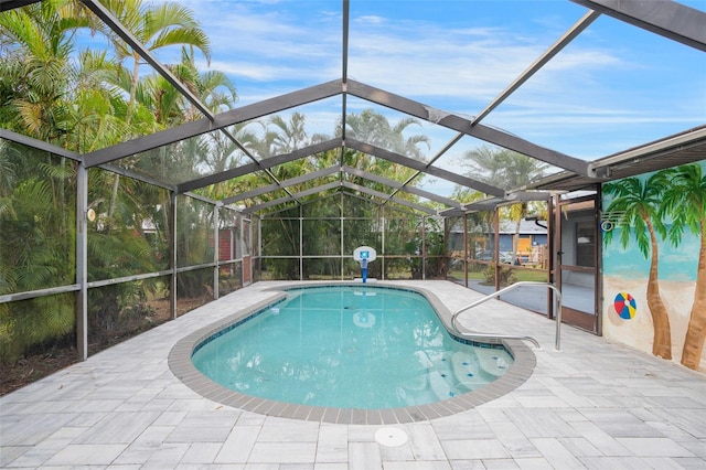 view of swimming pool with a patio and a lanai