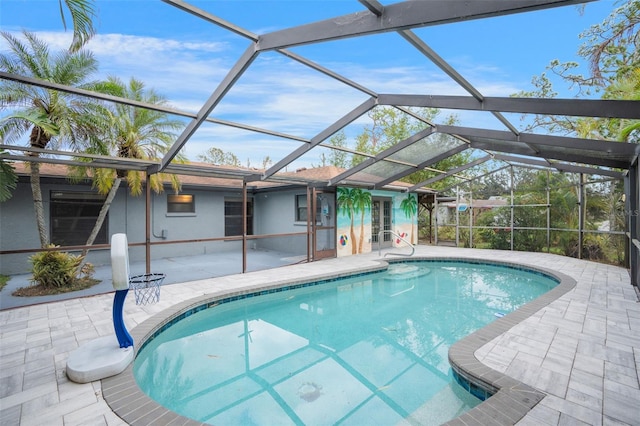 view of swimming pool with a patio area and glass enclosure