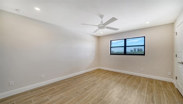 empty room with light hardwood / wood-style flooring and ceiling fan