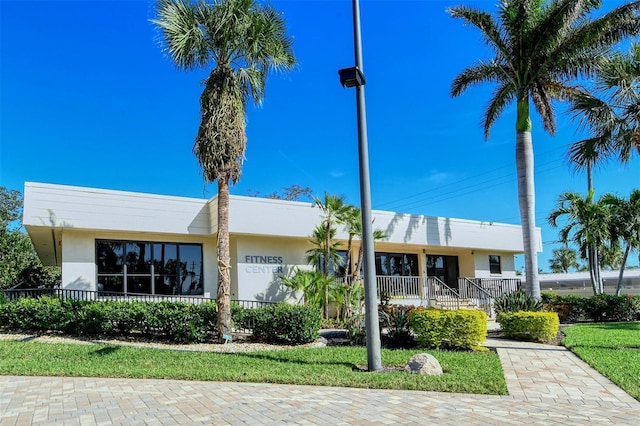 5760 Midnight Pass Rd Unit 307D, Sarasota, FL 34242 - view of front of home with stucco siding and covered porch