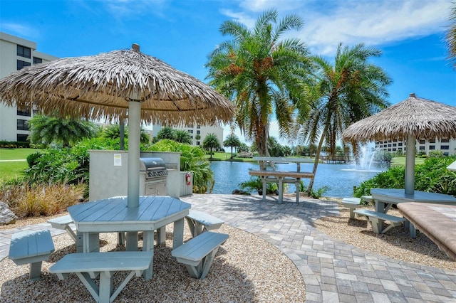 5760 Midnight Pass Rd Unit 307D, Sarasota, FL 34242 - view of patio / terrace featuring a water view and grilling area