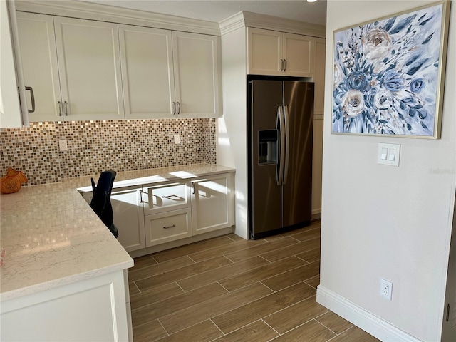 5760 Midnight Pass Rd Unit 307D, Sarasota, FL 34242 - kitchen featuring stainless steel fridge, dark wood-style floors, decorative backsplash, white cabinetry, and light stone countertops