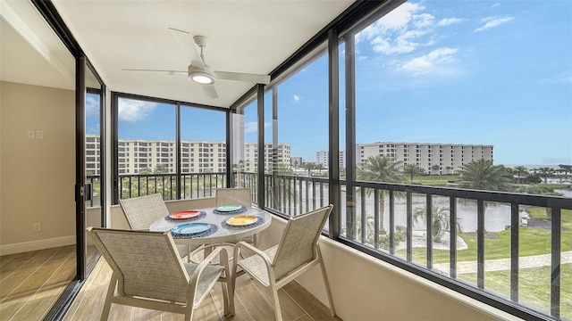 5760 Midnight Pass Rd Unit 307D, Sarasota, FL 34242 - sunroom / solarium featuring plenty of natural light and a view of city