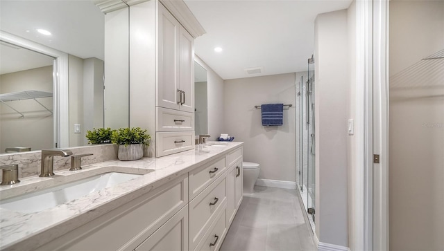5760 Midnight Pass Rd Unit 307D, Sarasota, FL 34242 - full bathroom featuring double vanity, a spacious closet, a shower stall, and recessed lighting