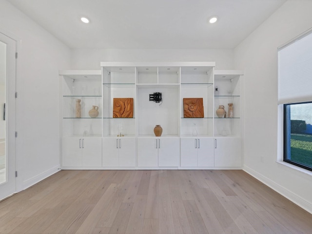5058 Surfside Cir, Lakewood Ranch, FL 34211 - spare room with wood finished floors and recessed lighting