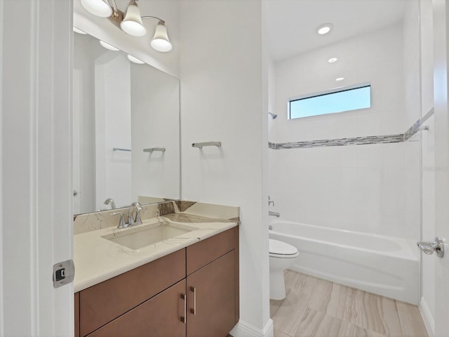 bathroom with shower / washtub combination, baseboards, vanity, and toilet