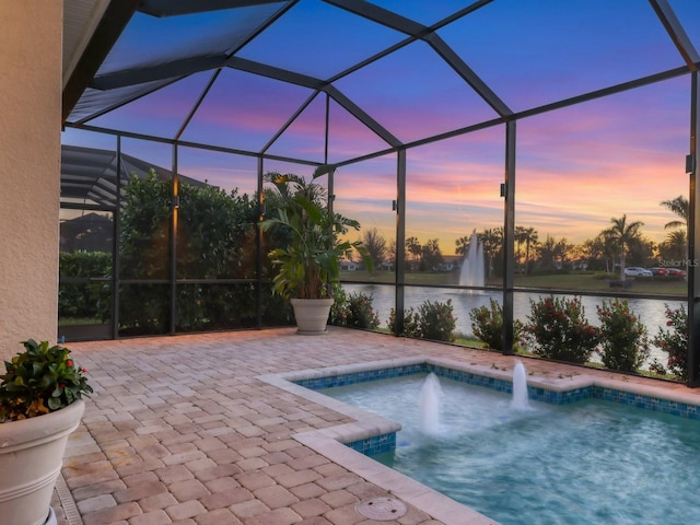 5058 Surfside Cir, Lakewood Ranch, FL 34211 - pool at dusk with a water view, an outdoor pool, a patio area, and glass enclosure