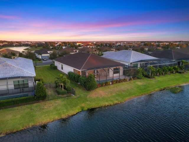 bird's eye view featuring a residential view and a water view