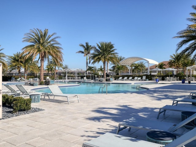 community pool featuring a patio area