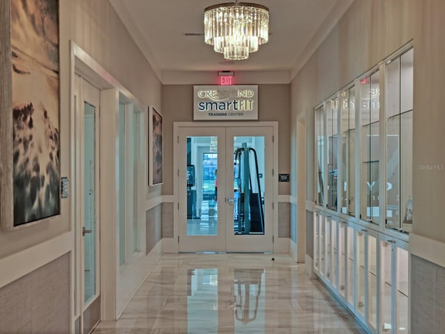 5058 Surfside Cir, Lakewood Ranch, FL 34211 - entryway with french doors, a chandelier, and marble tiled flooring