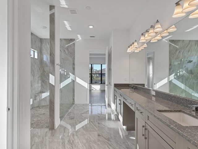 5058 Surfside Cir, Lakewood Ranch, FL 34211 - bathroom with a marble finish shower, marble tiled floors, double vanity, and recessed lighting