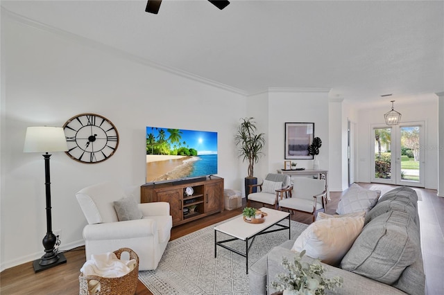 living room with hardwood / wood-style flooring, ceiling fan, crown molding, and french doors