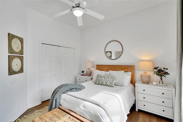 bedroom featuring a closet, dark wood-type flooring, and ceiling fan