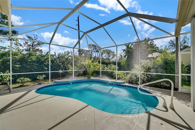 view of pool with a lanai and a patio area