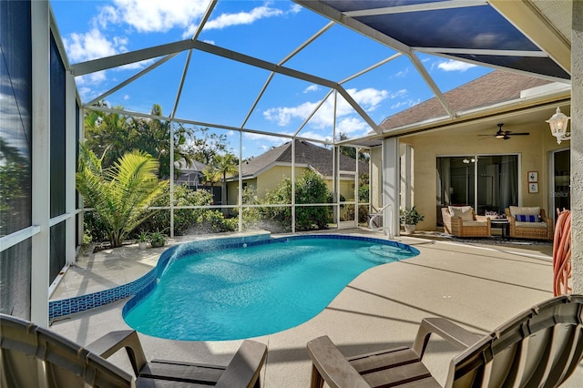 view of swimming pool with an outdoor hangout area, glass enclosure, ceiling fan, and a patio area