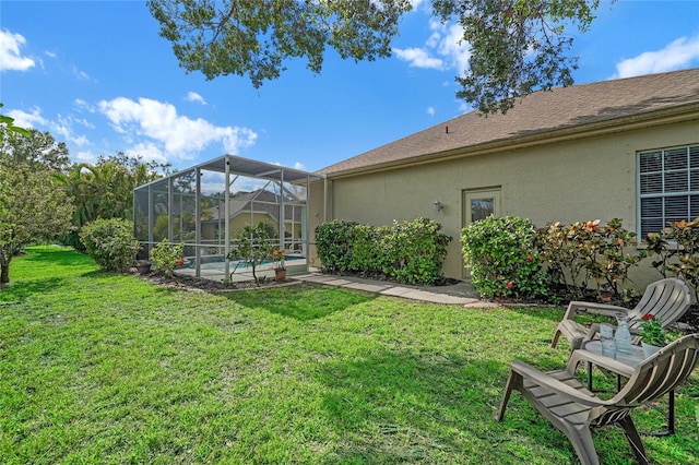 view of yard with a lanai