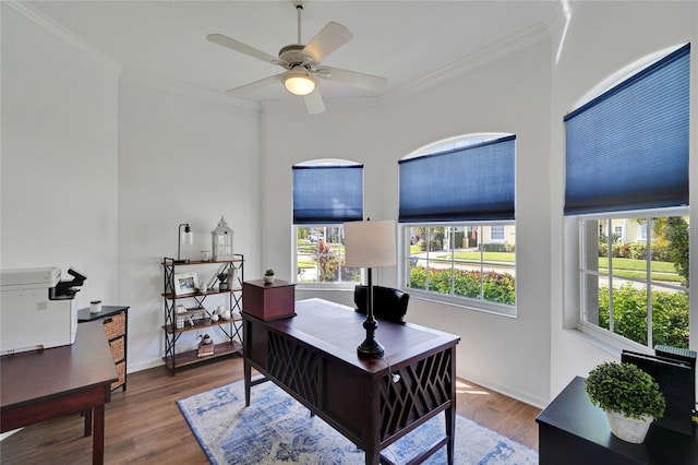 home office featuring ornamental molding, hardwood / wood-style flooring, ceiling fan, and a healthy amount of sunlight