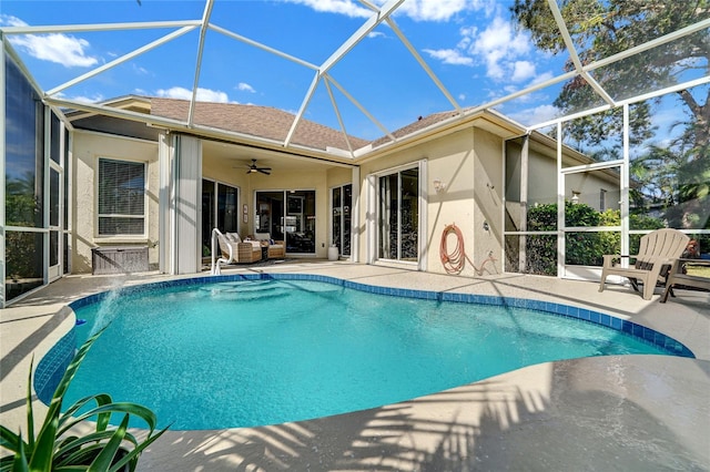 view of swimming pool featuring a lanai, ceiling fan, and a patio area