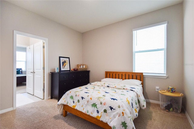 16926 Harvest Moon Way, Bradenton, FL 34211 - bedroom featuring carpet flooring, multiple windows, and baseboards