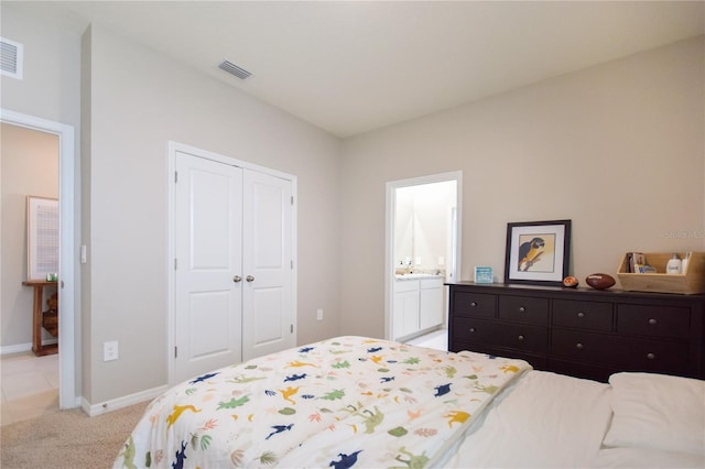 16926 Harvest Moon Way, Bradenton, FL 34211 - bedroom with a closet, baseboards, and light carpet