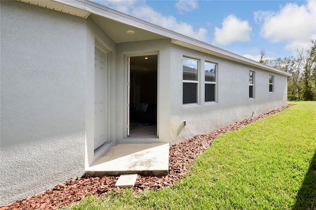 16926 Harvest Moon Way, Bradenton, FL 34211 - entrance to property with stucco siding and a yard