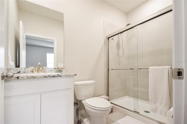 16926 Harvest Moon Way, Bradenton, FL 34211 - full bathroom with a stall shower, toilet, and vanity