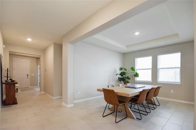 16926 Harvest Moon Way, Bradenton, FL 34211 - dining space featuring a tray ceiling, recessed lighting, and baseboards