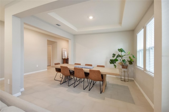 16926 Harvest Moon Way, Bradenton, FL 34211 - dining area with a tray ceiling and baseboards