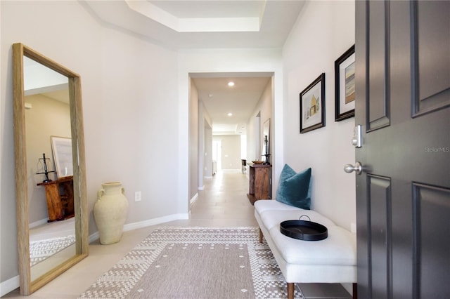 16926 Harvest Moon Way, Bradenton, FL 34211 - hallway featuring light tile patterned floors, baseboards, recessed lighting, and a tray ceiling